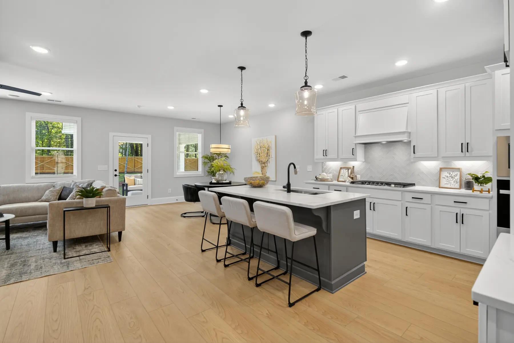 Bright modern kitchen and open living space photographed by Archetype Visuals